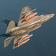 A F-35 conducts a test flight with four GBU-31 2,000 pound guided bombs and two AIM-9X Sidewinder missiles. The F-35 can carry weapons and fuel externally at the cost of its stealthy profile.